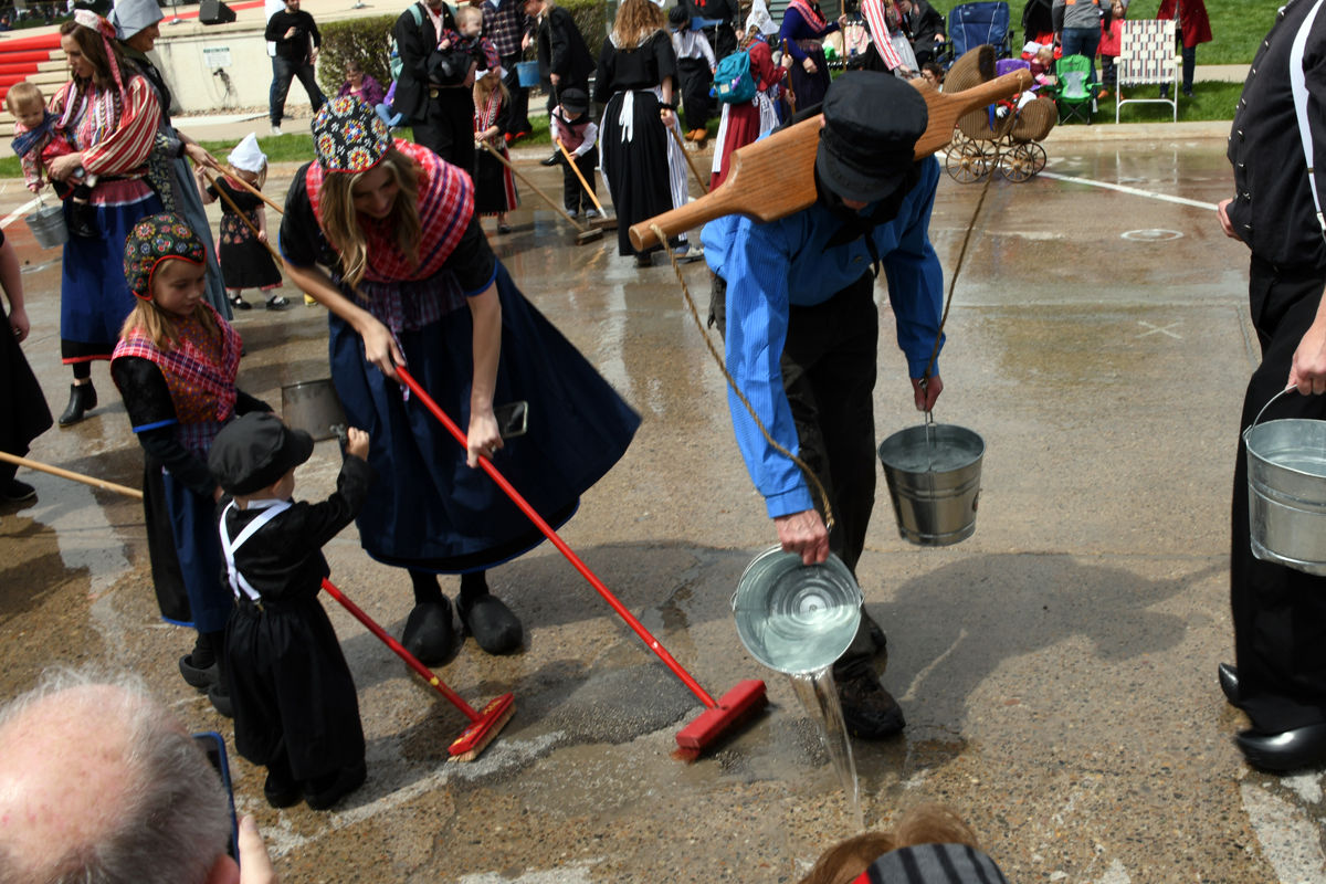 237 Men wore yokes on their shoulders to help them carry the buckets of water for the street scrubbers.JPG